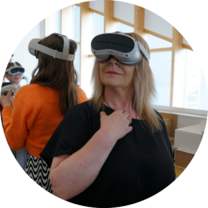 Woman trying a virtual reality headset at a Connected Threads session