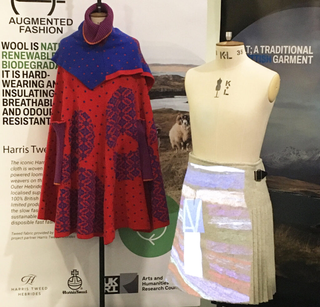 Augmented Fashion garments on mannequins in front of exhibition panels